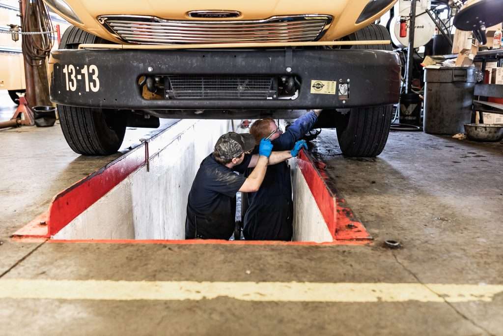 mechanics under bus